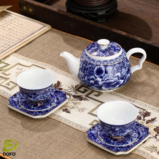 Blue and white old ice plum, one pot and two cups with coasters
