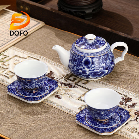 Blue and white old ice plum, one pot and two cups with coasters