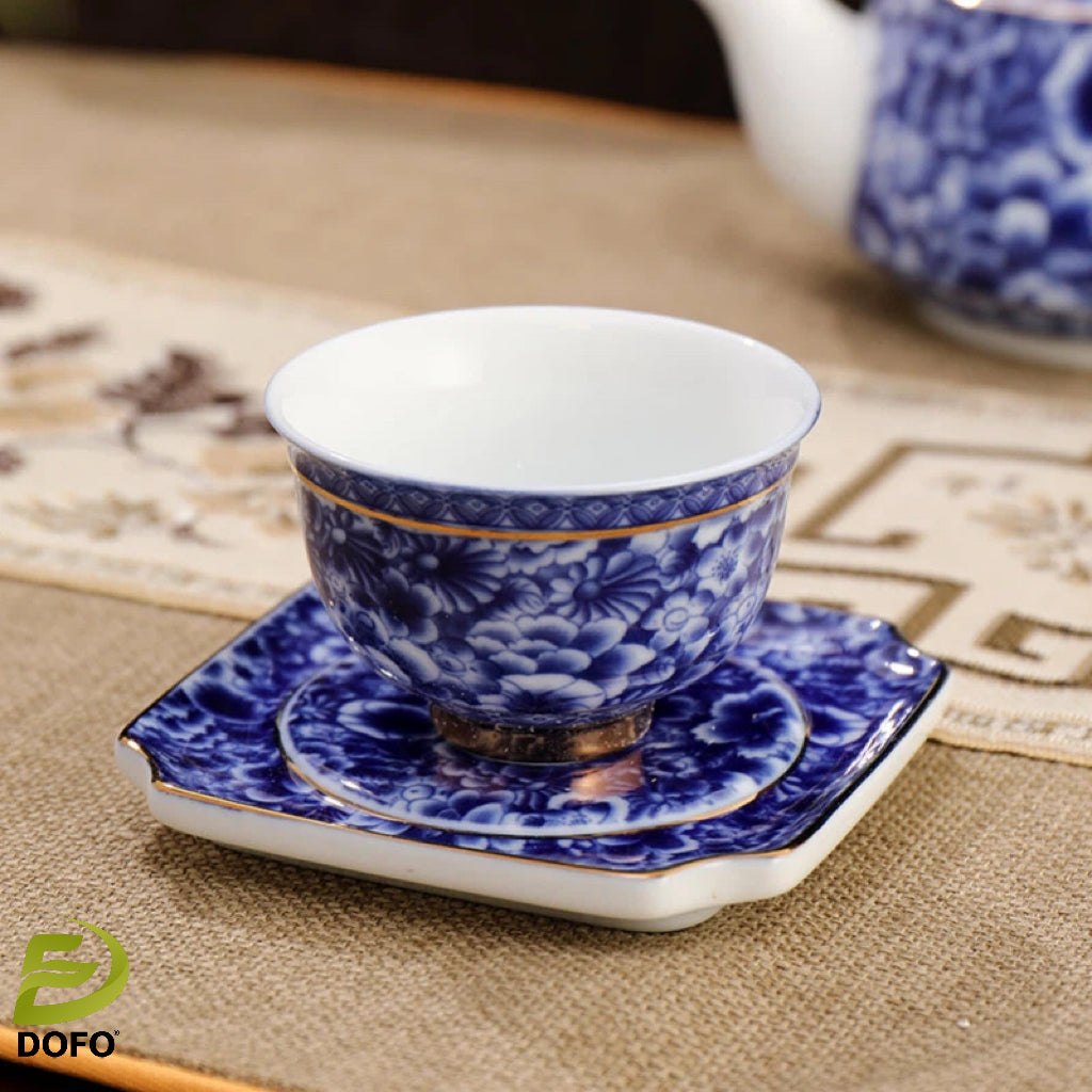 Blue and white old ice plum, one pot and two cups with coasters