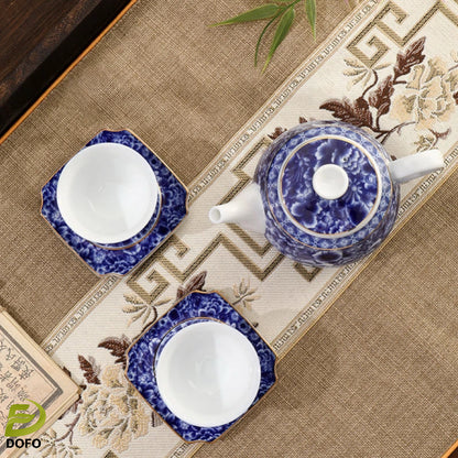 Blue and white old ice plum, one pot and two cups with coasters