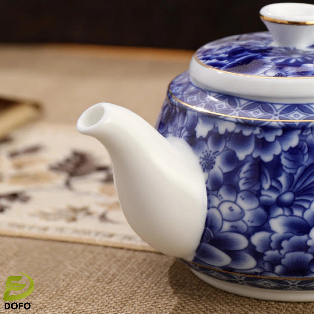 Blue and white old ice plum, one pot and two cups with coasters