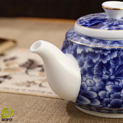 Blue and white old ice plum, one pot and two cups with coasters