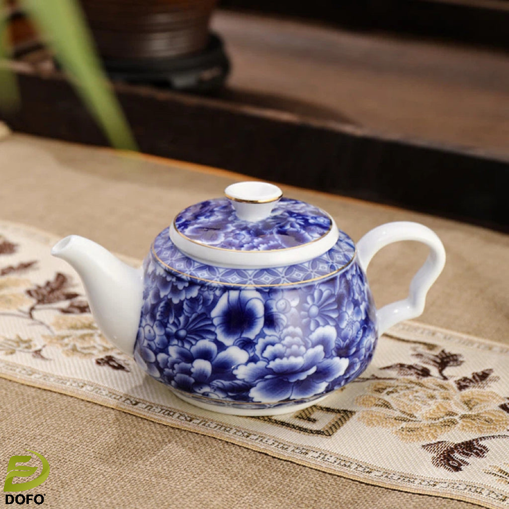 Blue and white old ice plum, one pot and two cups with coasters